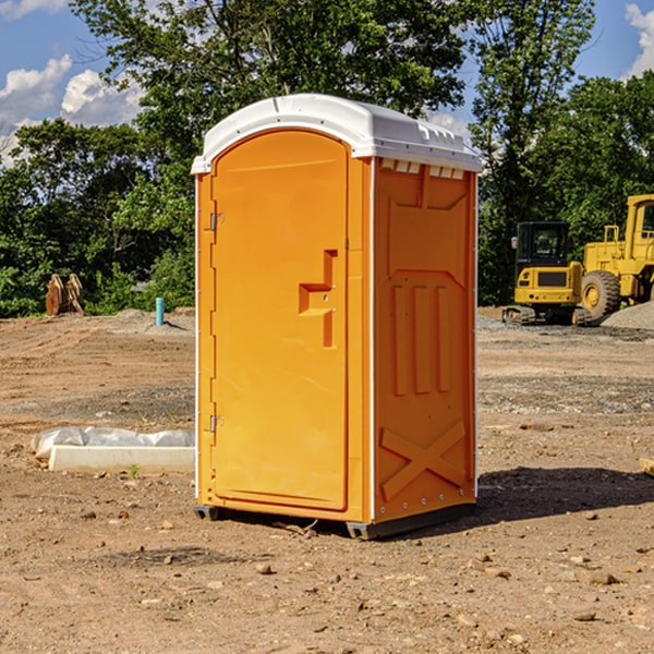 what is the cost difference between standard and deluxe porta potty rentals in Junius